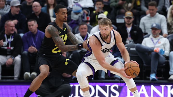 Oct 29, 2024; Salt Lake City, Utah, USA; Sacramento Kings forward Domantas Sabonis (11) looks to move the ball against Utah Jazz forward John Collins (20) during the third quarter at Delta Center. Mandatory Credit: Rob Gray-Imagn Images Oct 29, 2024; Salt Lake City, Utah, USA; Sacramento Kings forward Domantas Sabonis (11) looks to move the ball against Utah Jazz forward John Collins (20) during the third quarter at Delta Center. Mandatory Credit: Rob Gray-Imagn Images