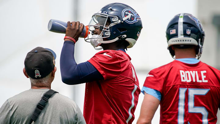 Tennessee Titans quarterback Cam Ward drinks water during minicamp practice at Ascension Saint Thomas Sports Park. Tennessee Titans quarterback Cam Ward drinks water during minicamp practice at Ascension Saint Thomas Sports Park.