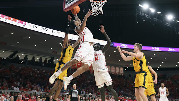 Nov 12, 2025; Houston, Texas, USA; Houston Cougars guard Ramon Walker Jr. (3) attempts to get control of the ball away from Oakland Golden Grizzlies guard Ziare Wells (2) during the first half at Fertitta Center. Mandatory Credit: Troy Taormina-Imagn Images