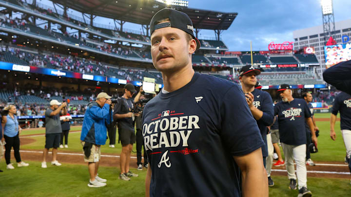 Atlanta Braves left fielder Jarred Kelenic (24) celebrates after clinching a wild card birth in the playoffs after a victory over the New York Mets at Truist Park in 2024.