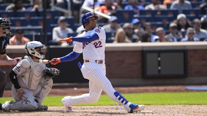 May 1, 2025; New York City, New York, USA; New York Mets right fielder Juan Soto (22) hits a home run against the Arizona Diamondbacks during the sixth inning at Citi Field. Mandatory Credit: Gregory Fisher-Imagn Images