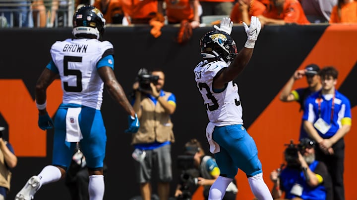Sep 14, 2025; Cincinnati, Ohio, USA; Jacksonville Jaguars running back Bhayshul Tuten (33) reacts after scoring a touchdown in the first half against the Cincinnati Bengals at Paycor Stadium. Mandatory Credit: Katie Stratman-Imagn Images