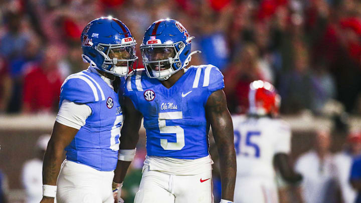Nov 15, 2025; Oxford, Mississippi, USA; Mississippi Rebels running back Kewan Lacy (5) celebrates with quarterback Trinidad Chambliss (6) after rushing for a touchdown against the Florida Gators during the first quarter at Vaught-Hemingway Stadium. Mandatory Credit: Petre Thomas-Imagn Images Nov 15, 2025; Oxford, Mississippi, USA; Mississippi Rebels running back Kewan Lacy (5) celebrates with quarterback Trinidad Chambliss (6) after rushing for a touchdown against the Florida Gators during the first quarter at Vaught-Hemingway Stadium. Mandatory Credit: Petre Thomas-Imagn Images