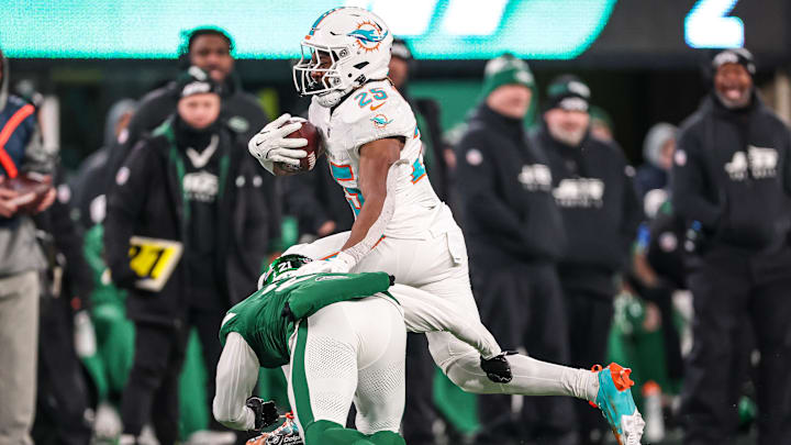 Miami Dolphins running back Jaylen Wright (25) fights for yards  as New York Jets safety Ashtyn Davis (21) tackles during the second half at MetLife Stadium last season