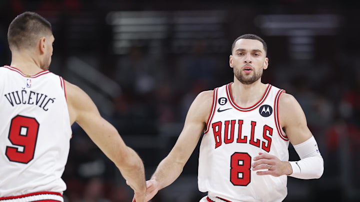 Chicago Bulls guard Zach LaVine (8) is congratulated by center Nikola Vucevic (9) after scoring against the Washington Wizards during the first half at United Center. Mandatory Credit: Kamil Krzaczynski-Imagn Images
