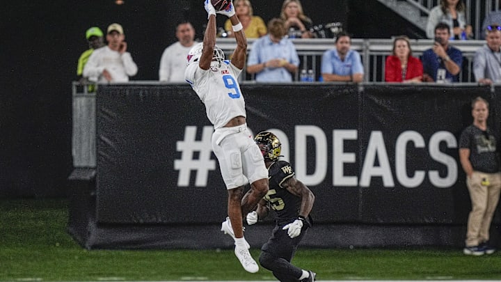 Sep 14, 2024; Winston-Salem, North Carolina, USA; Mississippi Rebels wide receiver Tre Harris (9) goes up for a catch while defended by Wake Forest Demon Deacons defensive back Jamare Glasker (25) during the second half at Allegacy Federal Credit Union Stadium. Mandatory Credit: Jim Dedmon-Imagn Images Sep 14, 2024; Winston-Salem, North Carolina, USA; Mississippi Rebels wide receiver Tre Harris (9) goes up for a catch while defended by Wake Forest Demon Deacons defensive back Jamare Glasker (25) during the second half at Allegacy Federal Credit Union Stadium. Mandatory Credit: Jim Dedmon-Imagn Images
