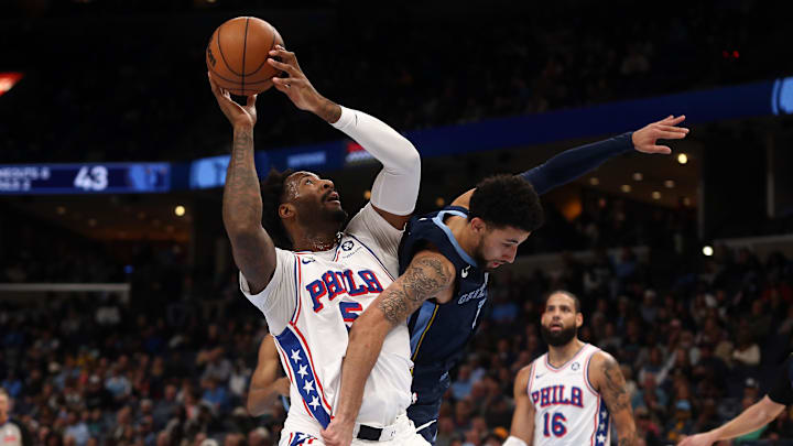Nov 20, 2024; Memphis, Tennessee, USA; Philadelphia 76ers center Andre Drummond (5) shoots as Memphis Grizzlies guard Scotty Pippen Jr. (1) defends during the first half at FedExForum. Mandatory Credit: Petre Thomas-Imagn Images