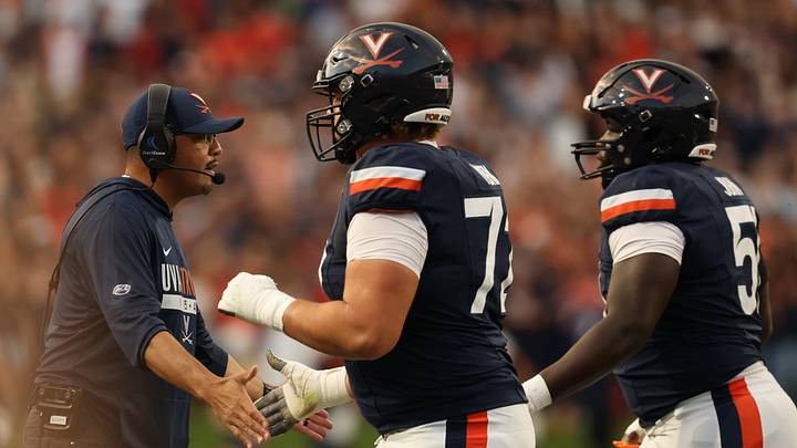 Sep 26, 2026; Charlottesville, Virginia, USA; Virginia Cavaliers head coach Tony Elliott celebrates with players as they run off the field after a touchdown against the Delaware Blue Hens during the first half at Scott Stadium. Mandatory Credit: Geoff Burke-Imagn Images Sep 26, 2026; Charlottesville, Virginia, USA; Virginia Cavaliers head coach Tony Elliott celebrates with players as they run off the field after a touchdown against the Delaware Blue Hens during the first half at Scott Stadium. Mandatory Credit: Geoff Burke-Imagn Images