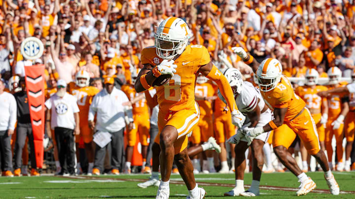 Sep 27, 2025; Starkville, Mississippi, USA; Tennessee Volunteers defensive back Colton Hood (8) runs with the ball after an interception against the Mississippi State Bulldogs during the first half at Davis Wade Stadium at Scott Field. Mandatory Credit: Wesley Hale-Imagn Images