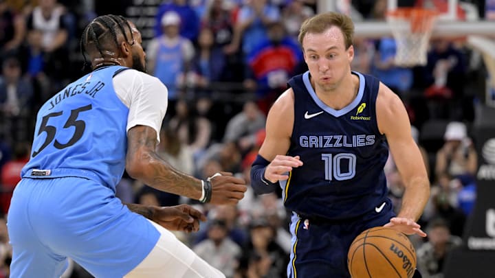 Mar 21, 2025; Inglewood, California, USA;  Memphis Grizzlies guard Luke Kennard (10) drives past Los Angeles Clippers forward Derrick Jones Jr. (55) in the first half at Intuit Dome. Mandatory Credit: Jayne Kamin-Oncea-Imagn Images