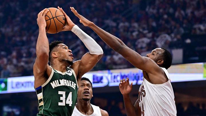Oct 26, 2025; Cleveland, Ohio, USA; Milwaukee Bucks forward Giannis Antetokounmpo (34) drives to the basket against Cleveland Cavaliers center Evan Mobley (4) during the first half at Rocket Arena. Mandatory Credit: Ken Blaze-Imagn Images