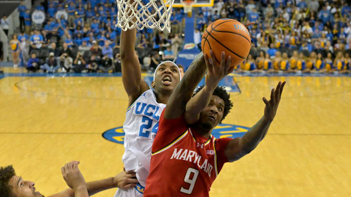 Jan 10, 2026; Los Angeles, California, USA;  UCLA Bruins center Steven Jamerson II (24) and Maryland Terrapins forward Solomon Washington (9) fight for a rebound during the second half at Pauley Pavilion presented by Wescom Financial. Mandatory Credit: Jayne Kamin-Oncea-Imagn Images