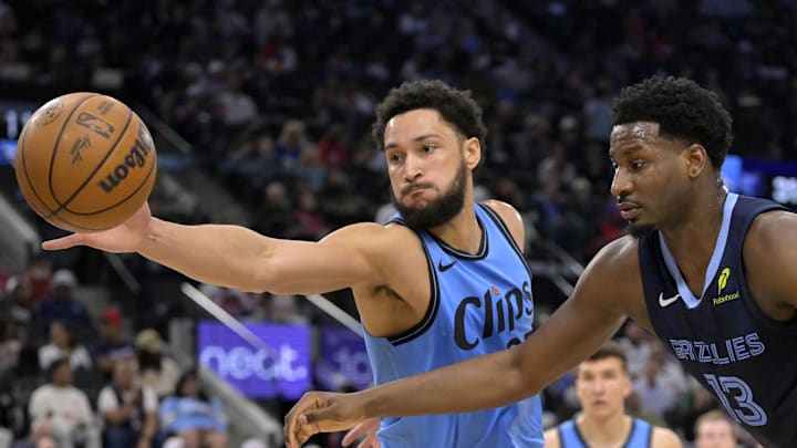 Mar 21, 2025; Inglewood, California, USA;  Los Angeles Clippers guard Ben Simmons (25) steals the ball from Memphis Grizzlies forward Jaren Jackson Jr. (13) in the first half at Intuit Dome. Mandatory Credit: Jayne Kamin-Oncea-Imagn Images