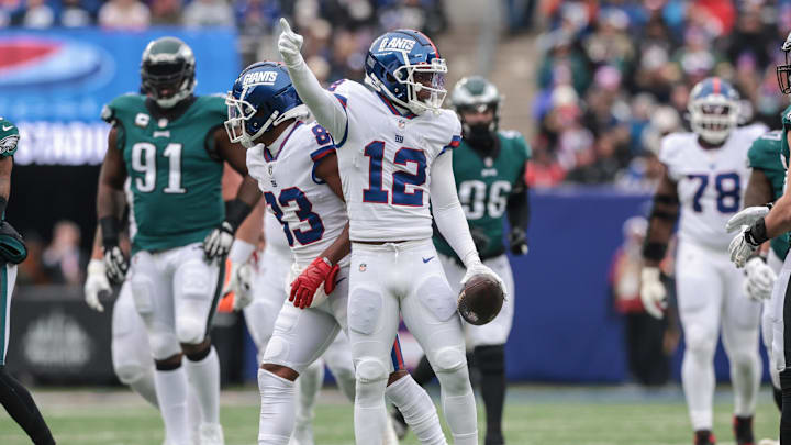Nov 28, 2021; East Rutherford, New Jersey, USA; New York Giants wide receiver John Ross (12) signals first down against the Philadelphia Eagles during the first half at MetLife Stadium. Mandatory Credit: Vincent Carchietta-USA TODAY Sports
