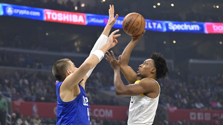 Apr 5, 2024; Los Angeles, California, USA; Los Angeles Clippers center Ivica Zubac (40) defends a shot by Utah Jazz guard Collin Sexton (2) in the first half at Crypto.com Arena. Mandatory Credit: Jayne Kamin-Oncea-Imagn Images