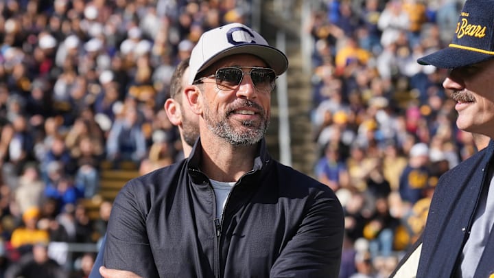 Nov 23, 2024; Berkeley, California, USA; California Golden Bears former quarterback Aaron Rodgers stands on the field before the start of the second quarter against the Stanford Cardinal at California Memorial Stadium. Mandatory Credit: Darren Yamashita-Imagn Images