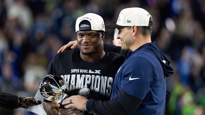 Feb 8, 2026; Santa Clara, CA, USA; Seattle Seahawks head coach Mike MacDonald and running back Kenneth Walker III (9) celebrate with the Vince Lombardi trophy after defeating the New England Patriots in Super Bowl LX at Levi's Stadium. Mandatory Credit: Mark J. Rebilas-Imagn Images