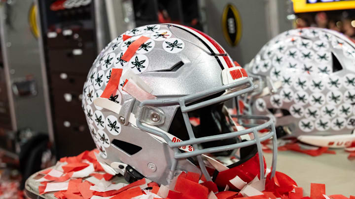 Jan 20, 2025; Atlanta, GA, USA; Detailed view of confetti with an Ohio State Buckeyes helmet after winning the CFP National Championship college football game at Mercedes-Benz Stadium. Mandatory Credit: Mark J. Rebilas-Imagn Images