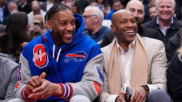 Mar 3, 2026; Toronto, Ontario, CAN; Former Toronto Raptors and Buffalo Bills minority owners Tracy McGrady (left) and Vince Carter (right) sit courtside during a game between the New York Knicks and Toronto Raptors the at Scotiabank Arena. Mandatory Credit: John E. Sokolowski-Imagn Images Mar 3, 2026; Toronto, Ontario, CAN; Former Toronto Raptors and Buffalo Bills minority owners Tracy McGrady (left) and Vince Carter (right) sit courtside during a game between the New York Knicks and Toronto Raptors the at Scotiabank Arena. Mandatory Credit: John E. Sokolowski-Imagn Images