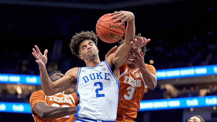 Duke v Texas; Duke basketball guard Cayden Boozer battles for a rebound Duke v Texas; Duke basketball guard Cayden Boozer battles for a rebound