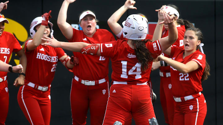 Indiana’s Sarah Stone (14) celebrates with her team after hitting a home run in the Big Ten softball tournament Friday, May 10, 2024 in Iowa City, Iowa.