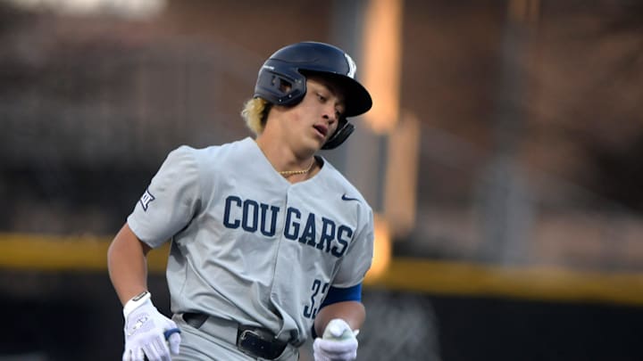BYU's designated hitter Kuhio Aloy (33) rounds the bases after scoring a grand slam against Texas Tech in game one of the Big 12 baseball series, Thursday, March 21, 2024, at Rip Griffin Park.
