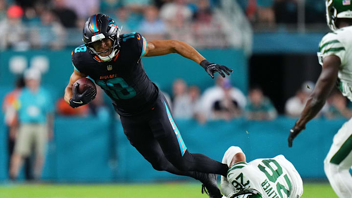 Miami Dolphins wide receiver Nick Westbrook-Ikhine (18) makes a catch against New York Jets safety Isaiah Oliver (26) during the second half at Hard Rock Stadium. Miami Dolphins wide receiver Nick Westbrook-Ikhine (18) makes a catch against New York Jets safety Isaiah Oliver (26) during the second half at Hard Rock Stadium.