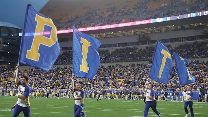 Oct 25, 2025; Pittsburgh, Pennsylvania, USA;  Pittsburgh Panthers cheerleaders celebrate a third quarter score against the North Carolina State Wolfpack at Acrisure Stadium. Mandatory Credit: Charles LeClaire-Imagn Images