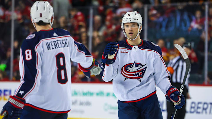 Jan 25, 2024; Calgary, Alberta, CAN; Columbus Blue Jackets center Adam Fantilli (11) celebrates his goal with teammates against the Calgary Flames during the third period at Scotiabank Saddledome. Mandatory Credit: Sergei Belski-USA TODAY Sports