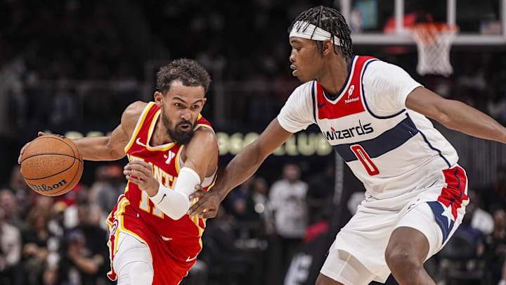 Oct 28, 2024; Atlanta, Georgia, USA; An Atlanta Hawks guard Trae Young (11) drives to the basket against Washington Wizards guard Bilal Coulibaly (0) during the second half at State Farm Arena. Mandatory Credit: Dale Zanine-Imagn Images