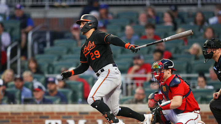May 5, 2023; Atlanta, Georgia, USA; Baltimore Orioles second baseman Ramon Urias (29) hits a single against the Atlanta Braves in May of 2023
