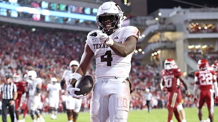 Oct 18, 2025; Fayetteville, Arkansas, USA; Texas A&M Aggies running back Rueben Owens II (4) celebrates after rushing for a touchdown in the fourth quarter against the Arkansas Razorbacks at Donald W. Reynolds Razorback Stadium. Mandatory Credit: Nelson Chenault-Imagn Images Oct 18, 2025; Fayetteville, Arkansas, USA; Texas A&M Aggies running back Rueben Owens II (4) celebrates after rushing for a touchdown in the fourth quarter against the Arkansas Razorbacks at Donald W. Reynolds Razorback Stadium. Mandatory Credit: Nelson Chenault-Imagn Images