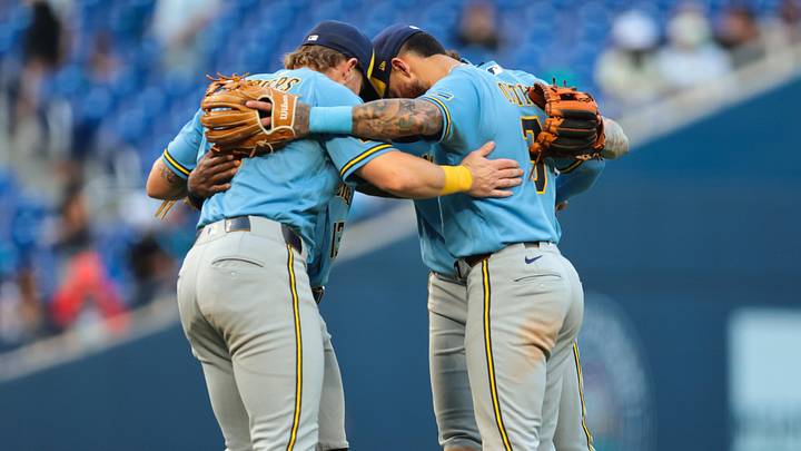 Apr 18, 2026; Miami, Florida, USA; Milwaukee Brewers shortstop Joey Ortiz (3) and first baseman Jake Bauers (9) celebrate with their teammates after the game against the Miami Marlins at loanDepot Park. Mandatory Credit: Sam Navarro-Imagn Images