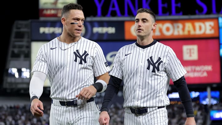 Oct 1, 2025; Bronx, New York, USA; New York Yankees right fielder Aaron Judge (99) talks to left fielder Cody Bellinger (35) after the fifth inning of game two of the Wildcard round of the 2025 MLB playoffs against the Boston Red Sox at Yankee Stadium. Mandatory Credit: Brad Penner-Imagn Images