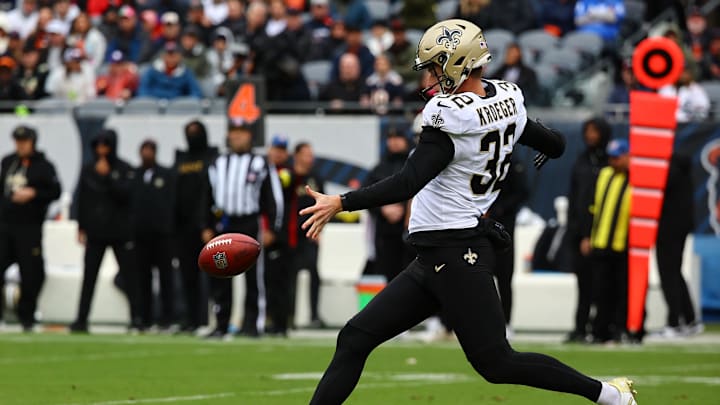 Oct 19, 2025; Chicago, Illinois, USA; New Orleans Saints punter Kai Kroeger (32) punts the ball to the Chicago Bears during the second half at Soldier Field. Mandatory Credit: Mike Dinovo-Imagn Images