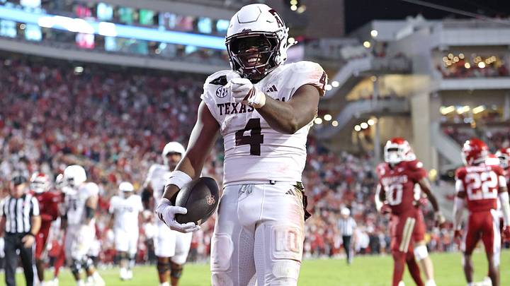Oct 18, 2025; Fayetteville, Arkansas, USA; Texas A&M Aggies running back Rueben Owens II (4) celebrates after rushing for a touchdown in the fourth quarter against the Arkansas Razorbacks at Donald W. Reynolds Razorback Stadium. Mandatory Credit: Nelson Chenault-Imagn Images