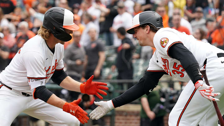 Baltimore Orioles shortstop Gunnar Henderson (2) greeted by catcher Adley Rutschman (35) following his solo home run in the first inning against the Minnesota Twins at Oriole Park at Camden Yards in Baltimore on April 17, 2024.