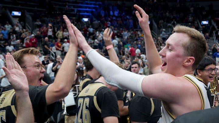 Purdue Boilermakers guard Fletcher Loyer (2) gives high fives to members of the band as he comes off the court following a NCAA Tournament second round game against the Miami Hurricanes on Sunday, March 22, 2026, at Enterprise Center in St. Louis. Purdue defeated Miami 79-69. Purdue Boilermakers guard Fletcher Loyer (2) gives high fives to members of the band as he comes off the court following a NCAA Tournament second round game against the Miami Hurricanes on Sunday, March 22, 2026, at Enterprise Center in St. Louis. Purdue defeated Miami 79-69.