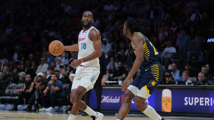 Feb 28, 2025; Miami, Florida, USA; Miami Heat guard Alec Burks (18) dribbles the basketball as Indiana Pacers forward Aaron Nesmith (23) defends during the fourth quarter at Kaseya Center. Mandatory Credit: Sam Navarro-Imagn Images