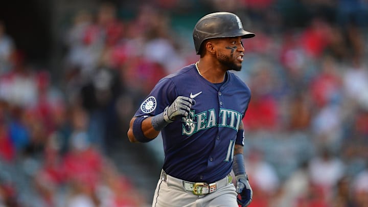 Seattle Mariners right fielder Victor Robles (10) runs after hitting an RBI single against the Los Angeles Angels during the first inning at Angel Stadium in 2024.