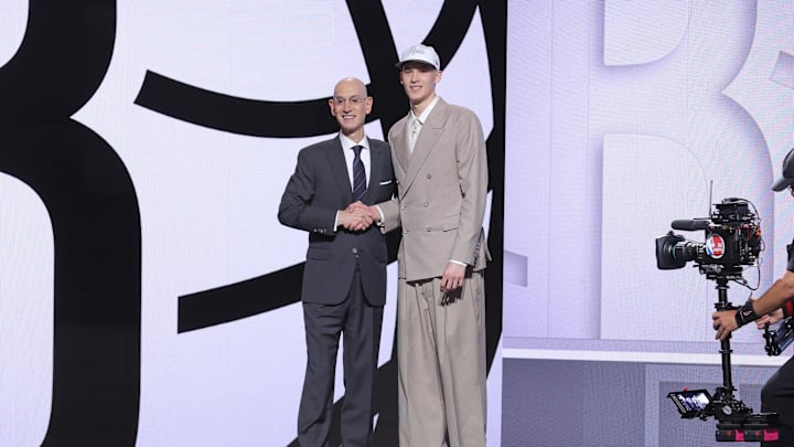 Jun 25, 2025; Brooklyn, NY, USA;  Egor Demin stands with NBA commissioner Adam Silver after being selected as the eighth pick by the Brooklyn Nets in the first round of the 2025 NBA Draft at Barclays Center. Mandatory Credit: Brad Penner-Imagn Images
