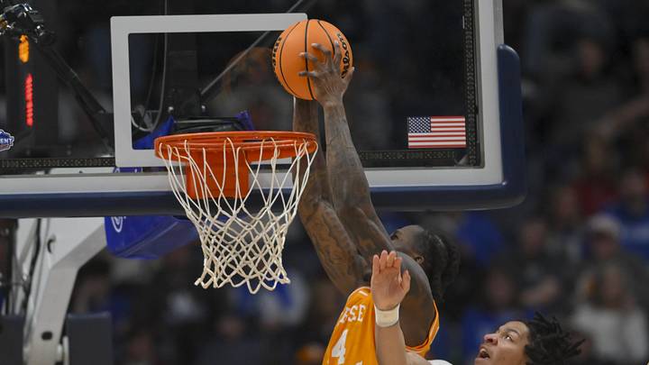 Mar 13, 2026; Nashville, TN, USA;  Tennessee Volunteers forward Felix Okpara (34) dunks the ball over Vanderbilt Commodores guard Chandler Bing (7) during the first half at Bridgestone Arena. Mandatory Credit: Steve Roberts-Imagn Images