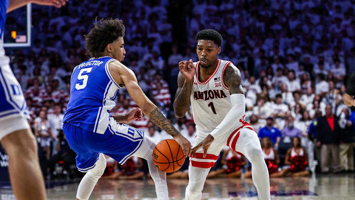 Nov 22, 2024; Tucson, Arizona, USA;  Duke Blue Devils guard Tyrese Proctor (5) steals the ball from Arizona Wildcats guard Caleb Love (1) during the second half at McKale Center. Mandatory Credit: Aryanna Frank-Imagn Images