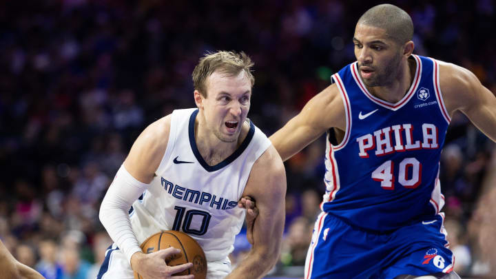 Mar 6, 2024; Philadelphia, Pennsylvania, USA; Memphis Grizzlies guard Luke Kennard (10) drives against Philadelphia 76ers forward Nicolas Batum (40) during the third quarter at Wells Fargo Center. Mandatory Credit: Bill Streicher-USA TODAY Sports