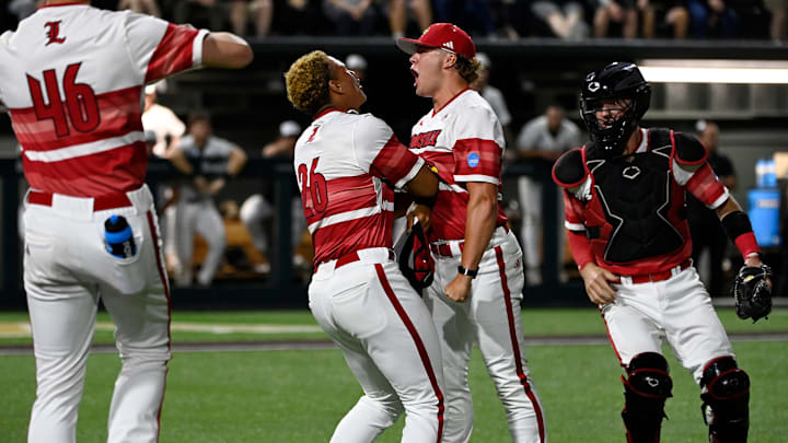 Louisville pitcher Jake Schweitzer (8) and Nate Earley (26) celebrate after their win against Vanderbilt in the Nashville Regional NCAA Baseball Tournament game at Hawkins Field Saturday, May 31, 2025, in Nashville, Tenn. Vanderbilt lost 3-2.