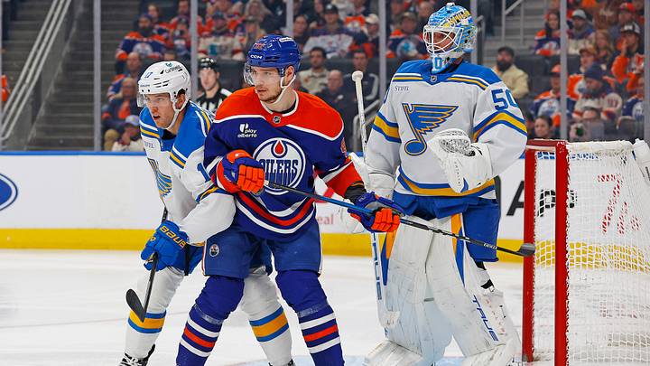 Jan 18, 2026; Edmonton, Alberta, CAN; Edmonton Oilers forward Vasily Podkolzin (92) attempts to screen St. Louis Blues goaltender Jordan Binnington (50) during the third period at Rogers Place. Mandatory Credit: Perry Nelson-Imagn Images