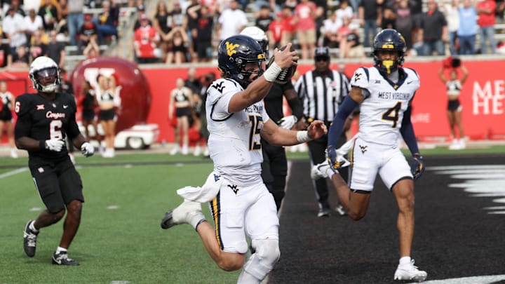 Nov 1, 2025; Houston, Texas, USA; West Virginia Mountaineers quarterback Scotty Fox Jr. (15) rushes for a touchdown against the Houston Cougars in the second half at TDECU Stadium. Mandatory Credit: Thomas Shea-Imagn Images Nov 1, 2025; Houston, Texas, USA; West Virginia Mountaineers quarterback Scotty Fox Jr. (15) rushes for a touchdown against the Houston Cougars in the second half at TDECU Stadium. Mandatory Credit: Thomas Shea-Imagn Images