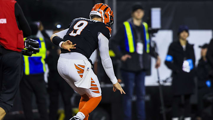 Dec 28, 2024; Cincinnati, Ohio, USA; Cincinnati Bengals quarterback Joe Burrow (9) reacts after scoring a touchdown against the Denver Broncos in the second half at Paycor Stadium. Mandatory Credit: Katie Stratman-Imagn Images