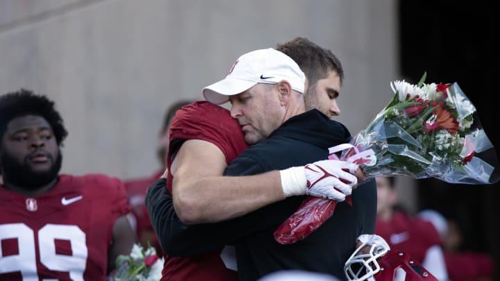 Nov 25, 2023; Stanford, California, USA; Stanford Cardinal head coach Troy Taylor hugs graduating senior outside linebacker Lance Keneley before taking on the Notre Dame Fighting Irish at Stanford Stadium. Mandatory Credit: D. Ross Cameron-USA TODAY Sports