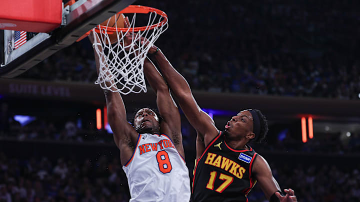 Apr 18, 2026; New York, New York, USA; New York Knicks forward Og Anunoby (8) goes to the basket as Atlanta Hawks forward Onyeka Okongwu (17) defends during the first half of the 2026 NBA Playoffs at Madison Square Garden. Mandatory Credit: Vincent Carchietta-Imagn Images